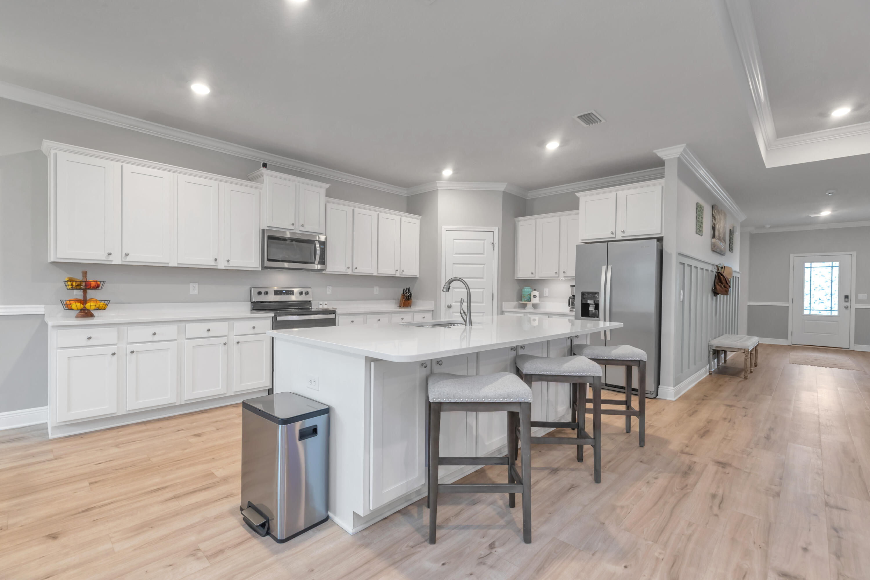18 Hammock Circle Freeport, FL 32439 - Photo 18 of 50 a kitchen with stainless steel appliances a sink a stove a refrigerator cabinets and wooden floor