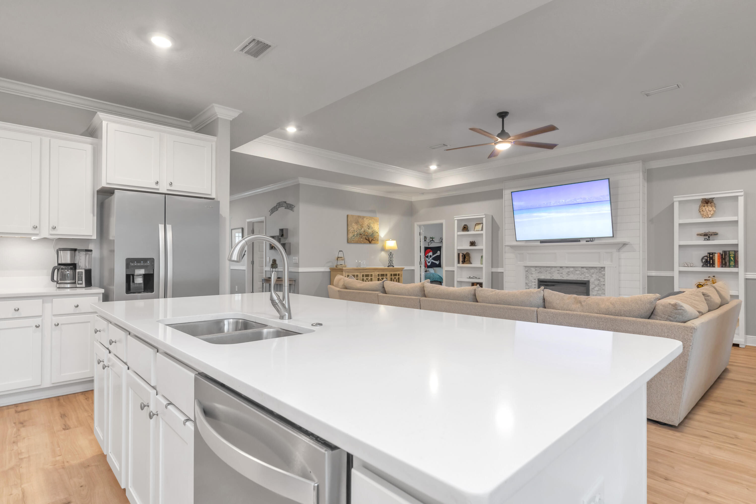 18 Hammock Circle Freeport, FL 32439 - Photo 19 of 50 a large kitchen with kitchen island a stove a sink a refrigerator dining table and chairs