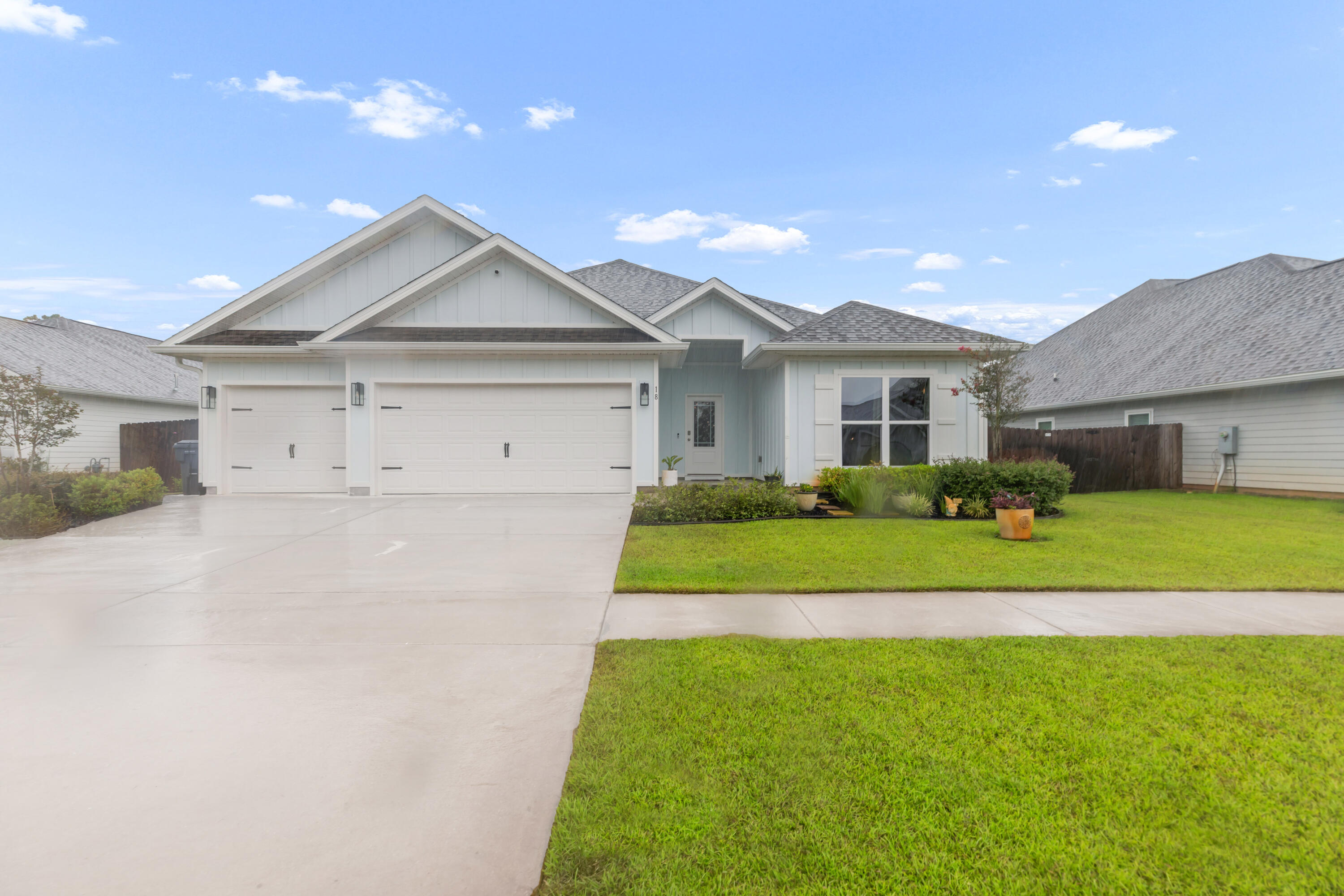 18 Hammock Circle Freeport, FL 32439 - Photo 2 of 50 a front view of a house with a yard and porch