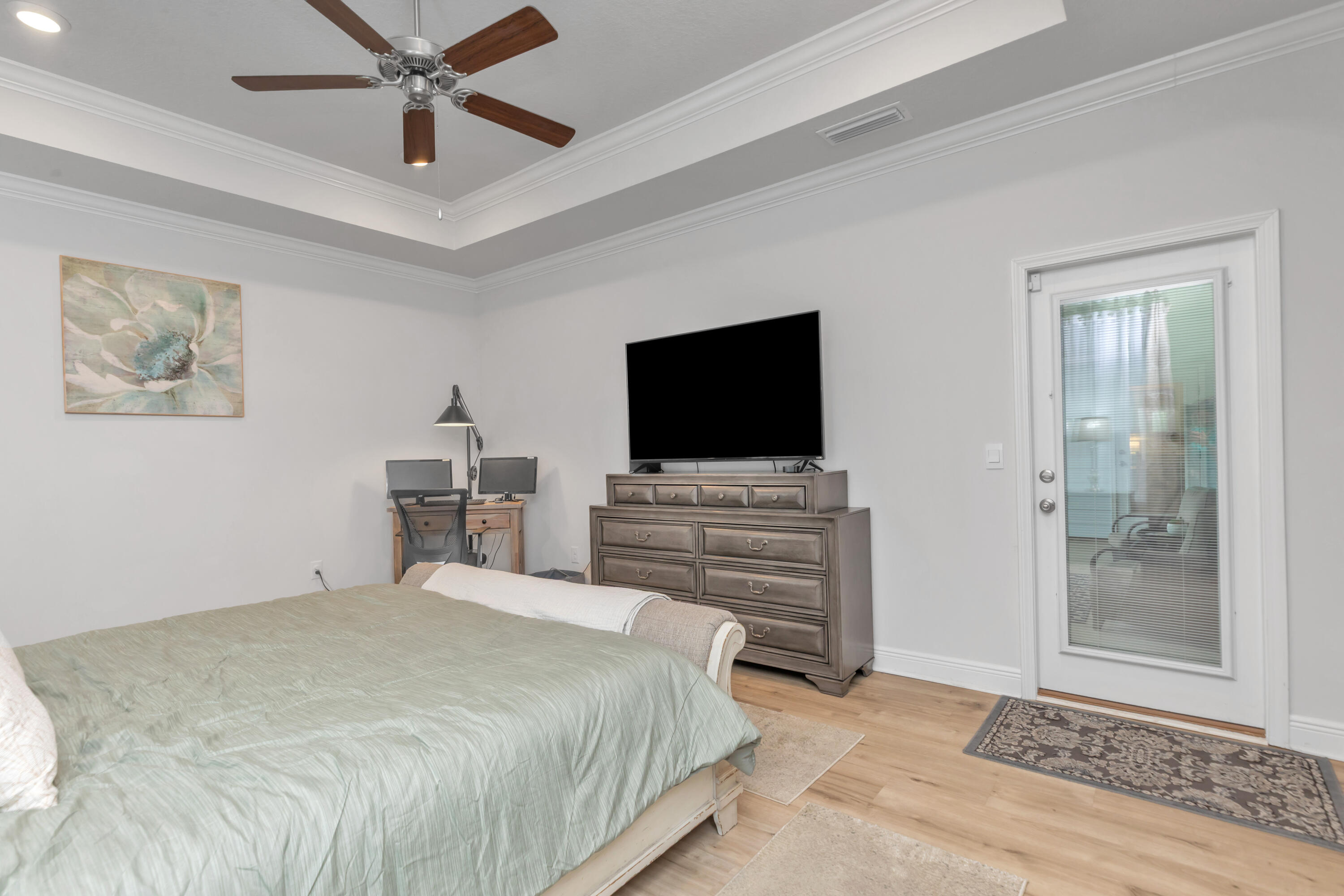 18 Hammock Circle Freeport, FL 32439 - Photo 23 of 50 a bedroom with a bed and a flat screen tv