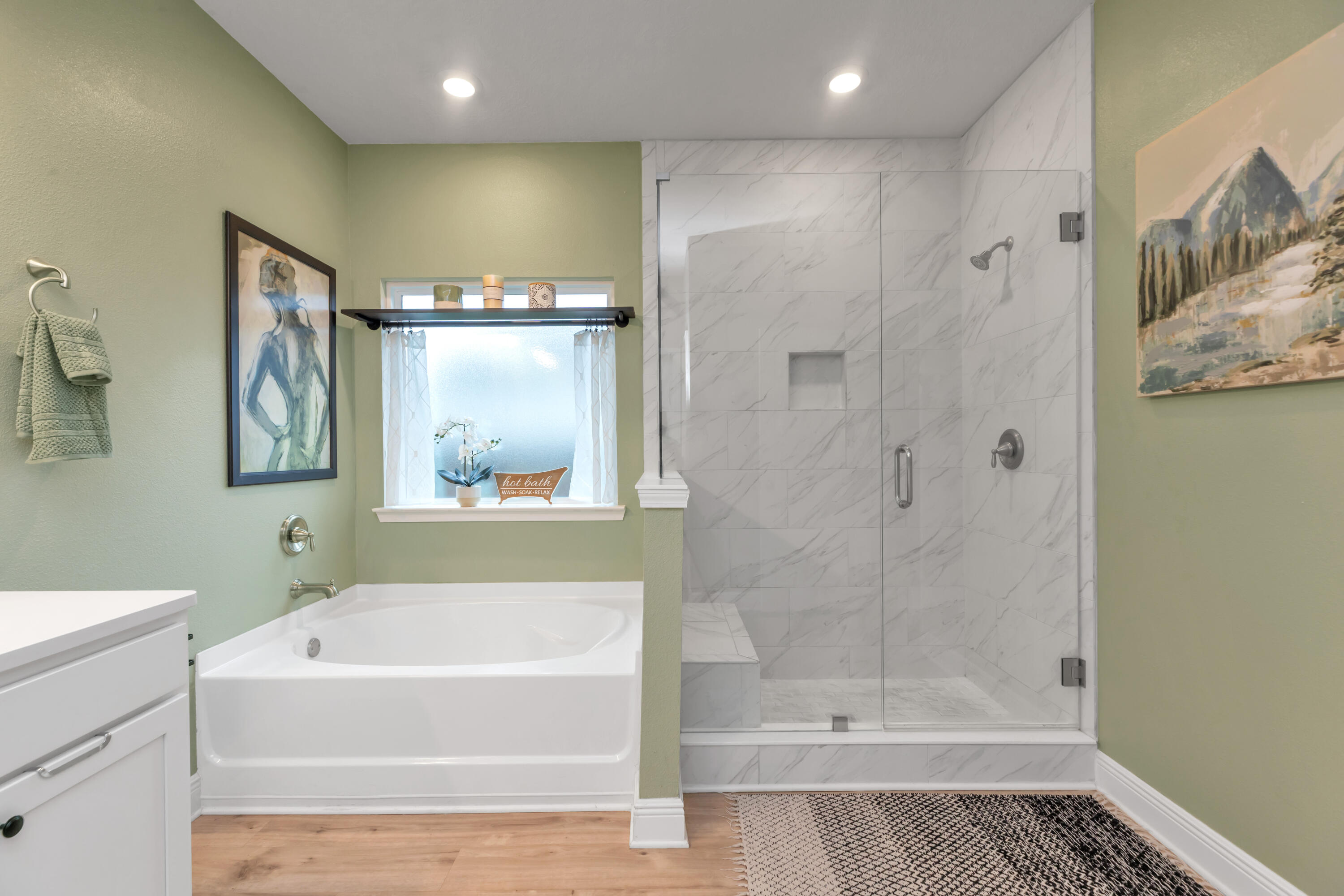 18 Hammock Circle Freeport, FL 32439 - Photo 26 of 50 a bathroom with a bathtub and a shower