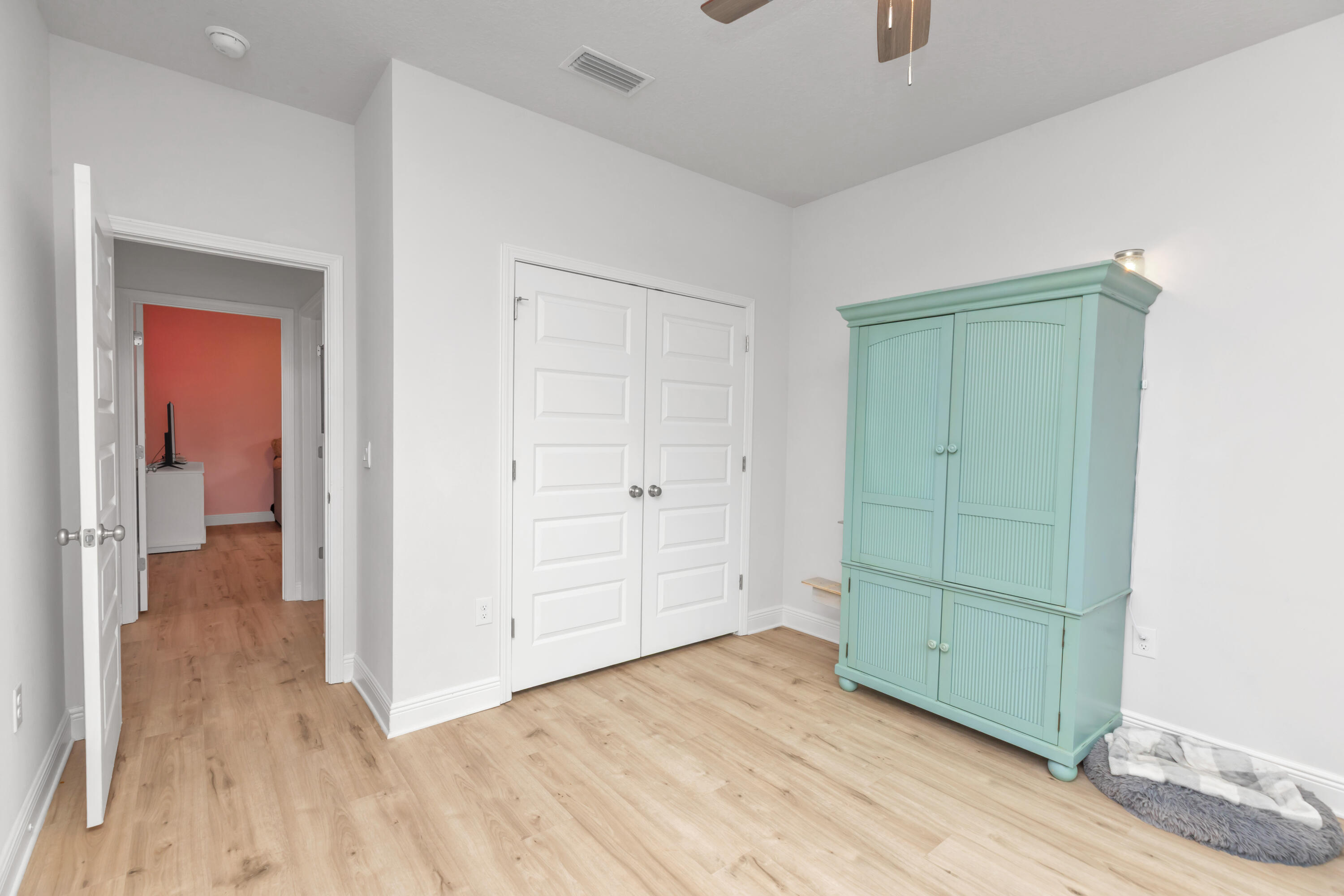 18 Hammock Circle Freeport, FL 32439 - Photo 30 of 50 an empty room with wooden floor and closet