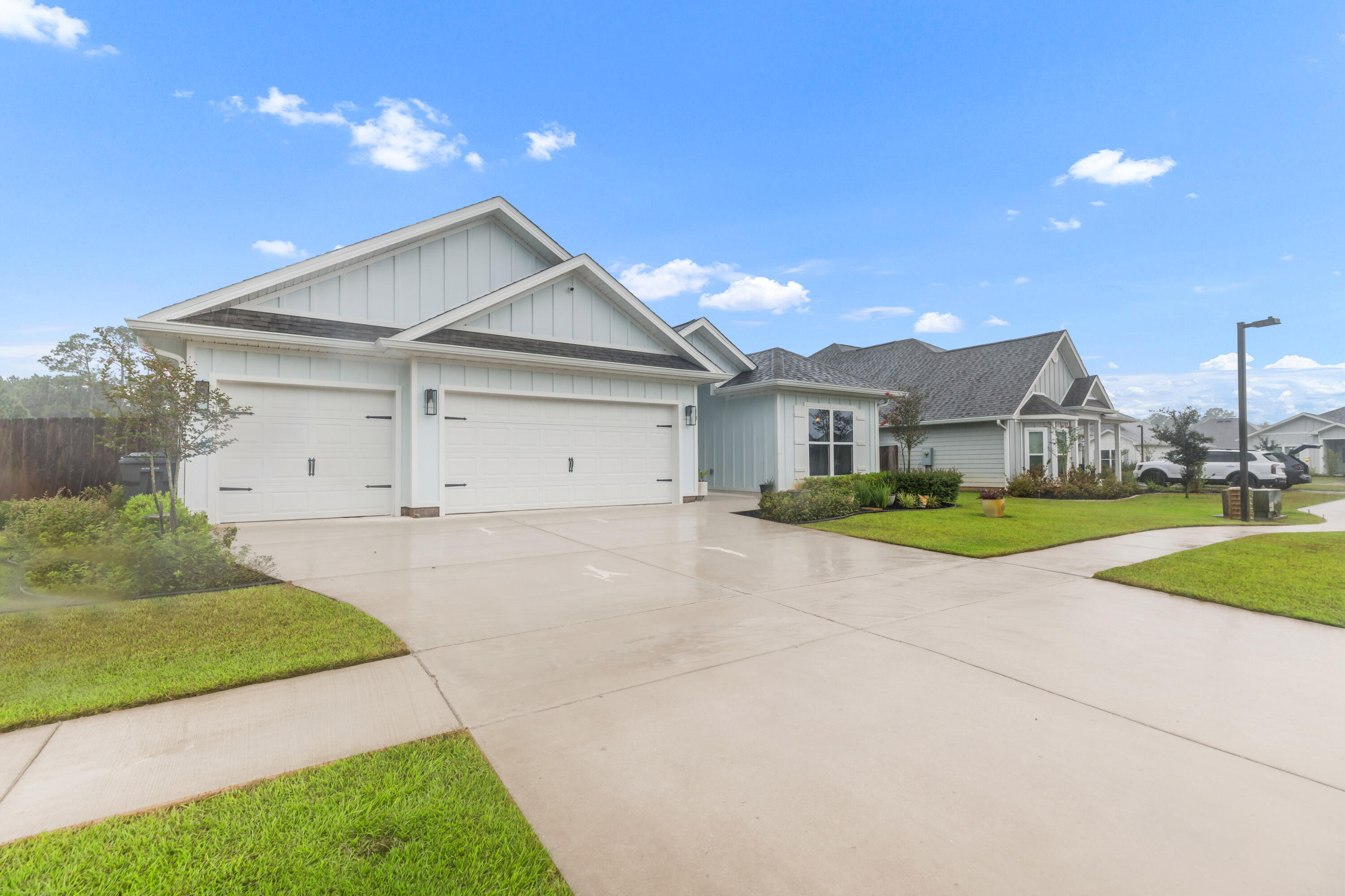 18 Hammock Circle Freeport, FL 32439 - Photo 3 of 50 a view of a house with a yard and garage