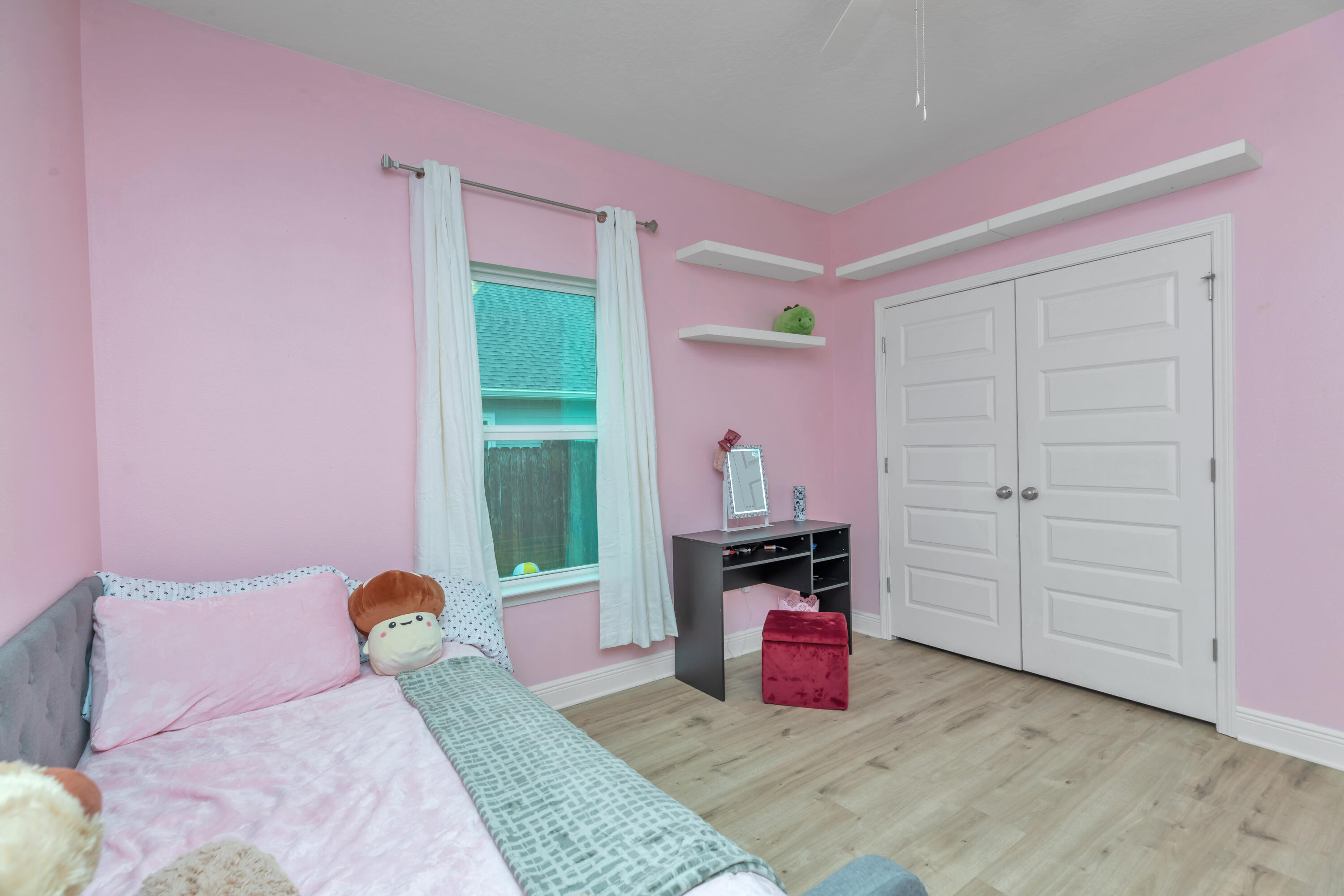 18 Hammock Circle Freeport, FL 32439 - Photo 33 of 50 a bedroom with a bed and a dresser