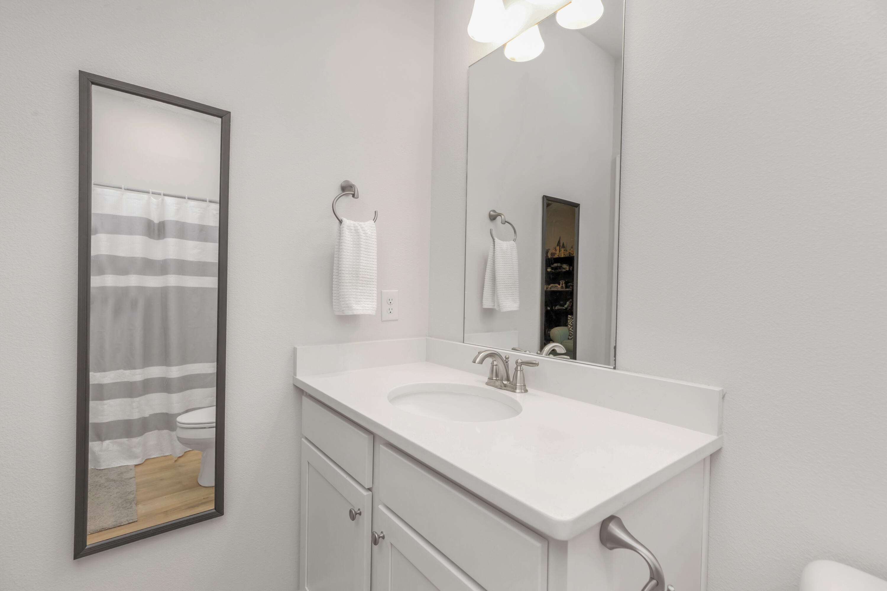 18 Hammock Circle Freeport, FL 32439 - Photo 40 of 50 a bathroom with a sink vanity and a mirror