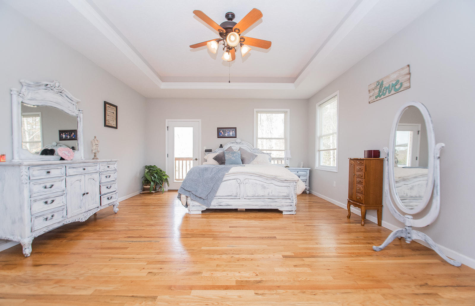 1056 Oyler Road Hardy, VA 24101 - Photo 21 of 45 a spacious bedroom with a bed a dresser and mirror
