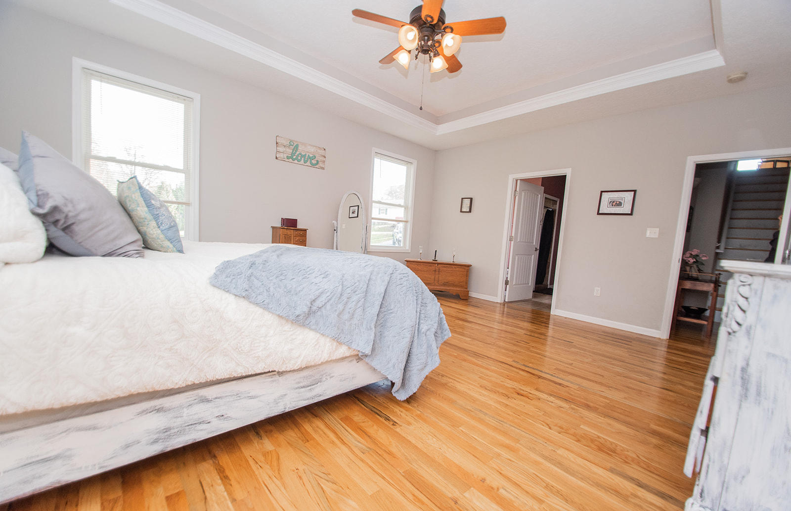 1056 Oyler Road Hardy, VA 24101 - Photo 22 of 45 a spacious bedroom with a bed and a flat tv screen on dresser