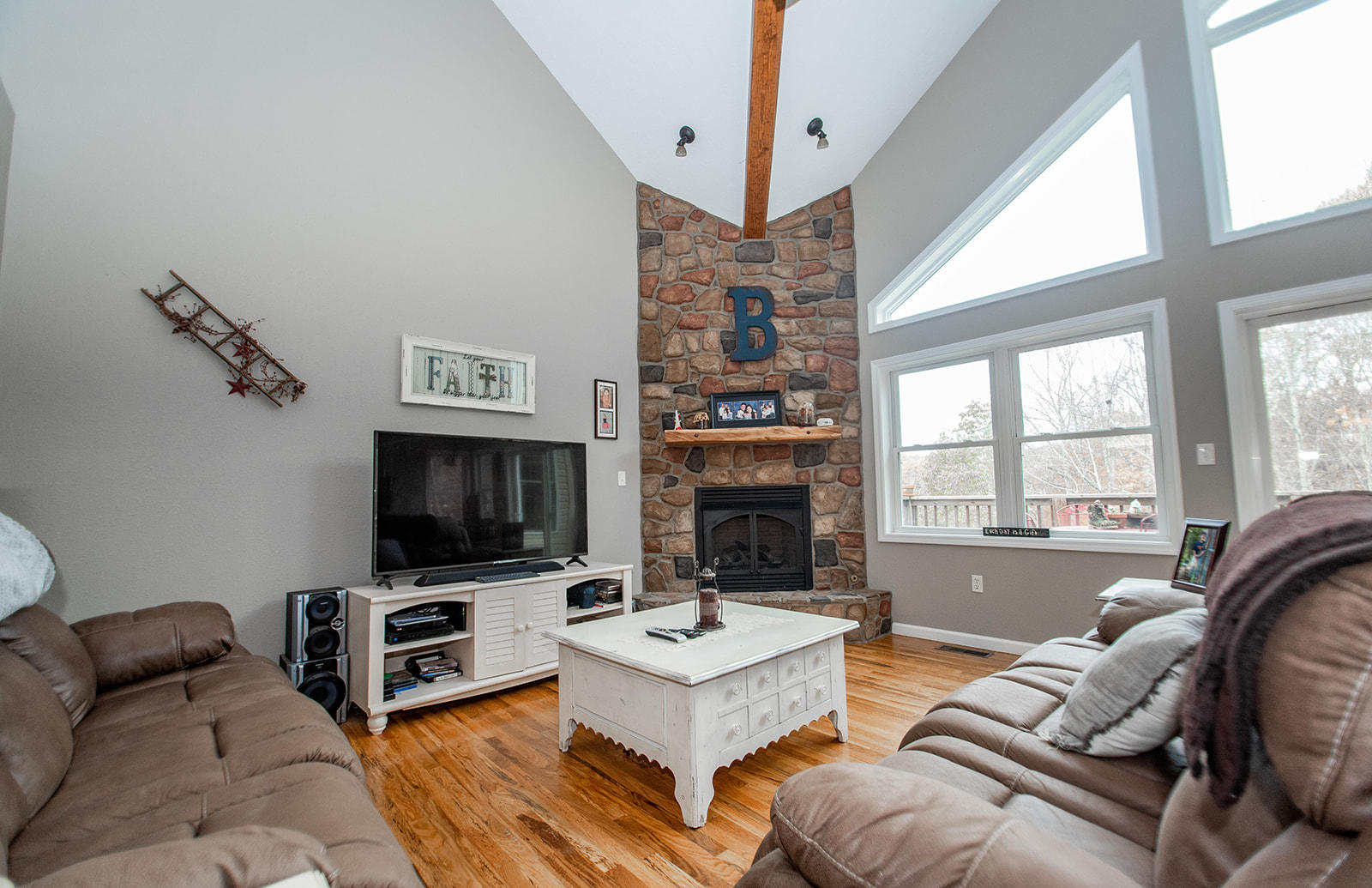 1056 Oyler Road Hardy, VA 24101 - Photo 4 of 45 a living room with furniture a flat screen tv and a fireplace