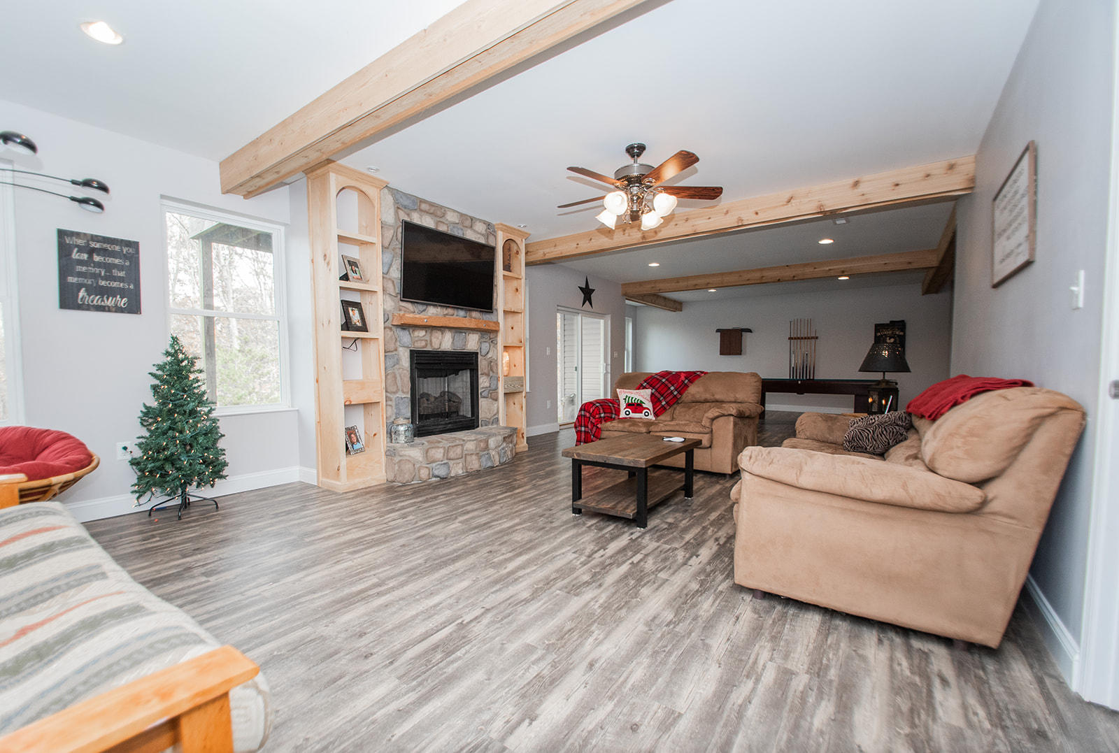 1056 Oyler Road Hardy, VA 24101 - Photo 34 of 45 a living room with furniture a flat screen tv and a fireplace