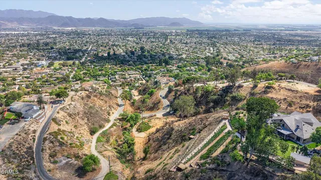 a view of a city with mountains in the background