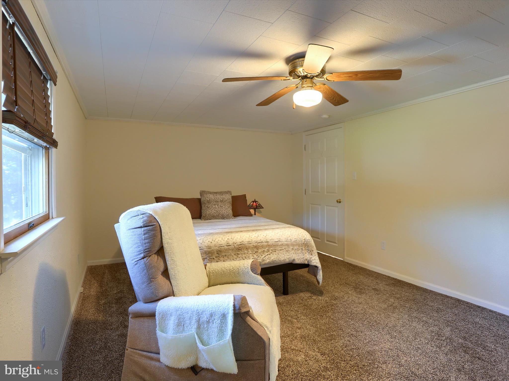 5333 Spruce Road Fayetteville, PA 17222 - Photo 16 of 40 a living room with furniture and a ceiling fan