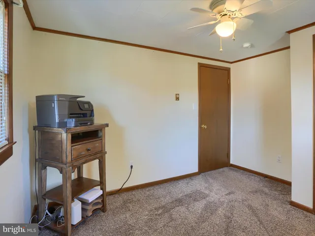 a view of a workspace with furniture