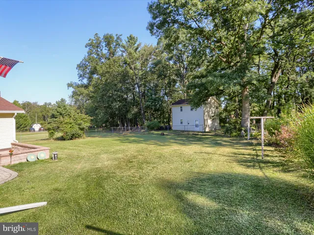 a fire hydrant in the middle of a field