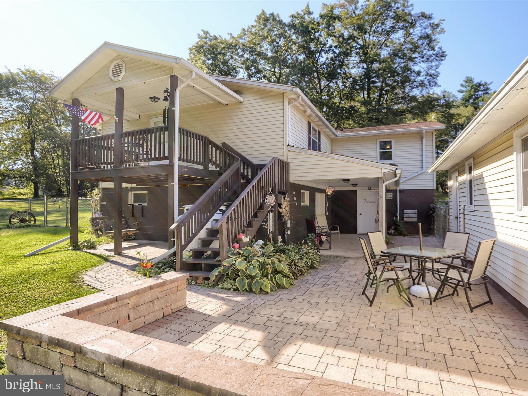 5333 Spruce Road Fayetteville, PA 17222 - Photo 31 of 40 a view of a house with backyard and sitting area
