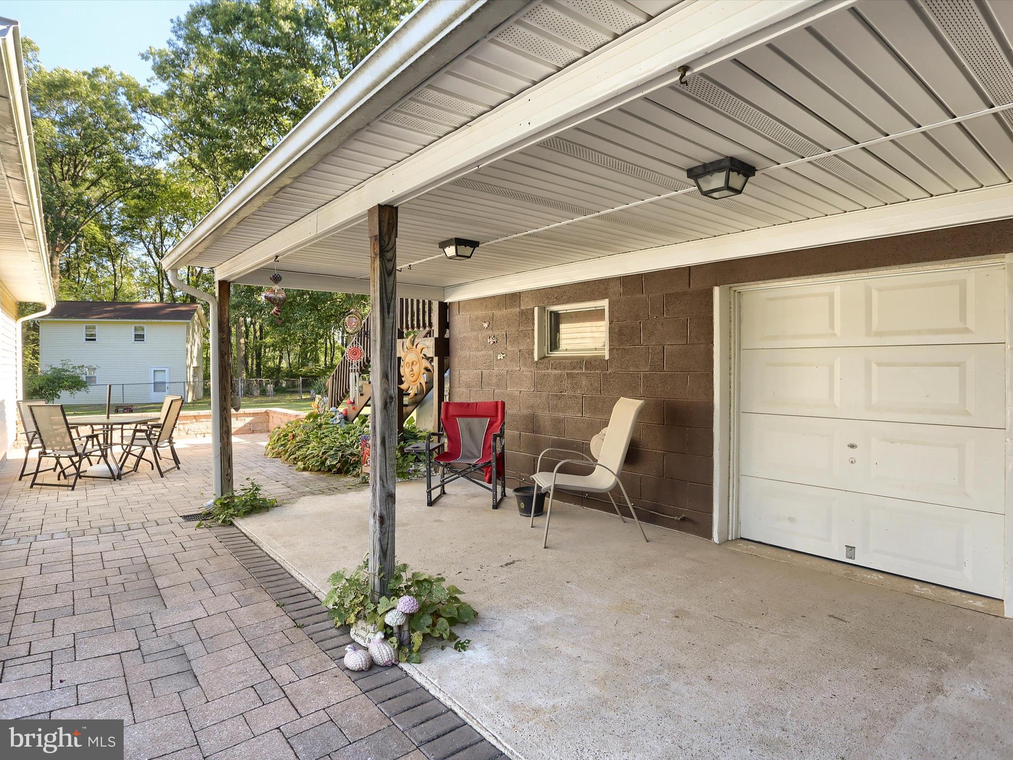 5333 Spruce Road Fayetteville, PA 17222 - Photo 33 of 40 a view of a patio with table and chairs and potted plants