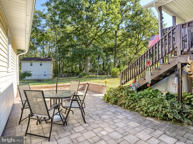 a view of a chairs and table in the balcony