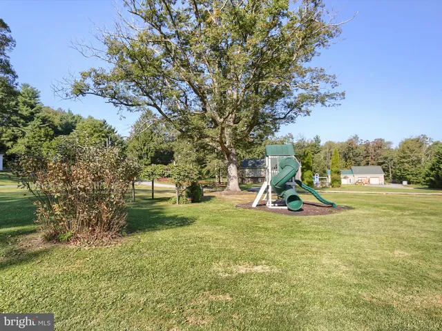 a view of a park with swings and slides