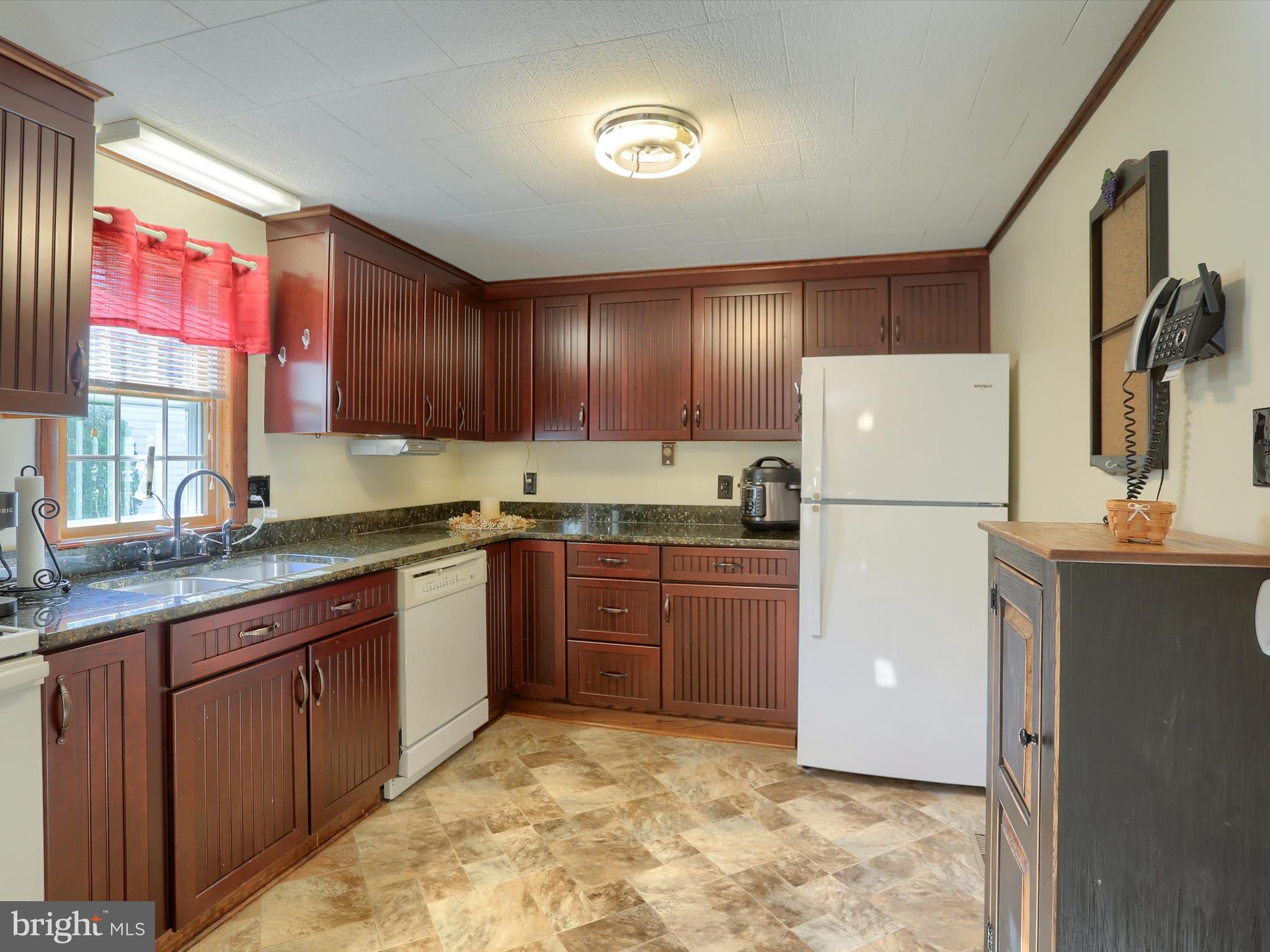 5333 Spruce Road Fayetteville, PA 17222 - Photo 8 of 40 a kitchen with granite countertop a refrigerator and a sink