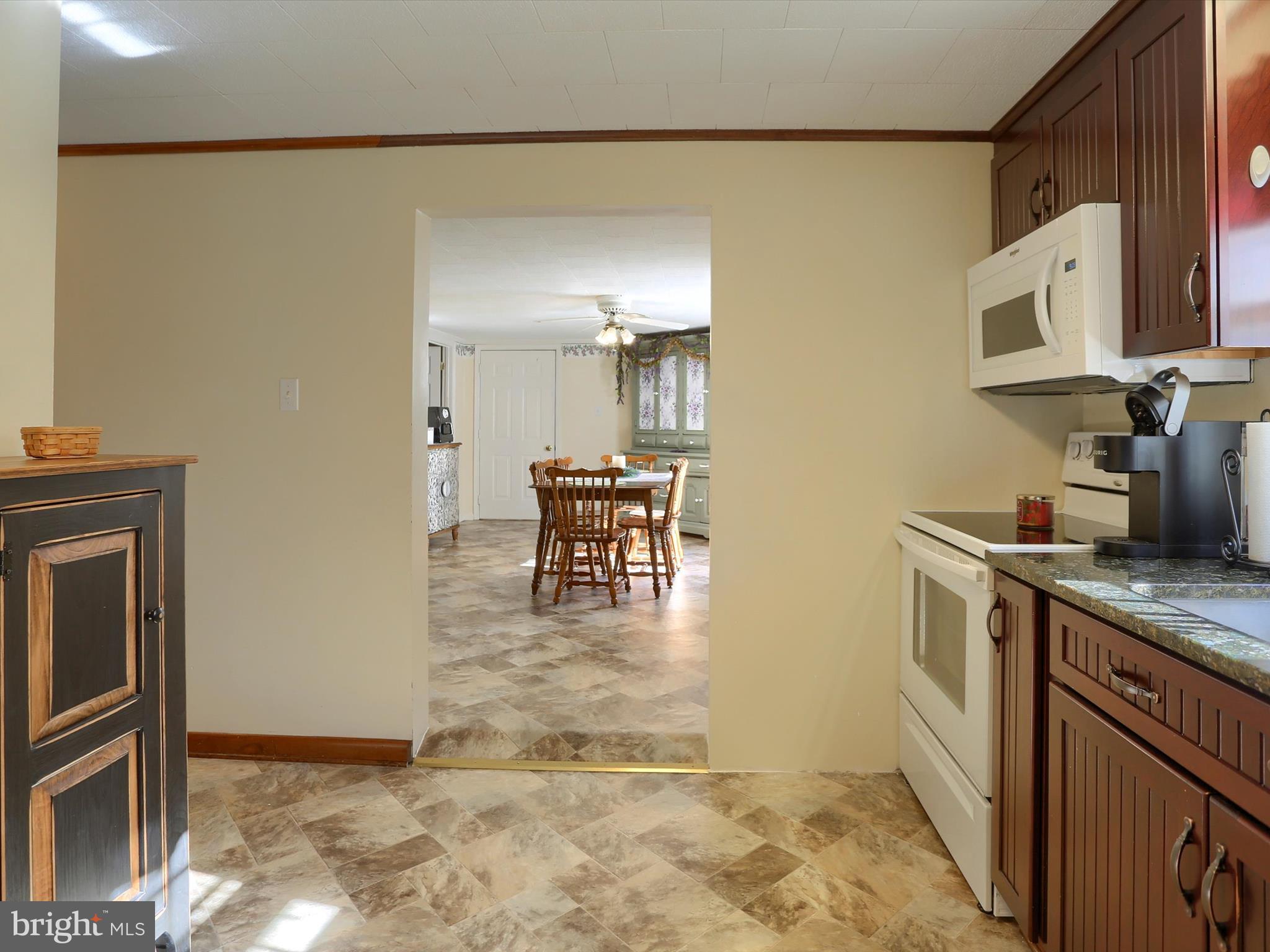 5333 Spruce Road Fayetteville, PA 17222 - Photo 10 of 40 a kitchen with stainless steel appliances granite countertop a sink and a stove top oven