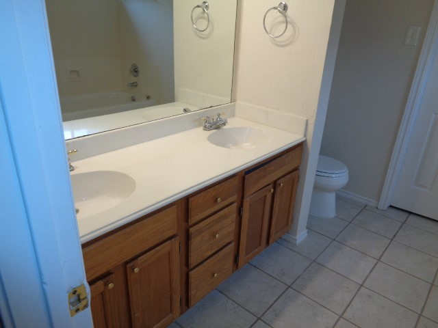 17823 Poppy Trails Lane Houston, TX 77084 - Photo 15 of 22 a bathroom with a sink and a mirror