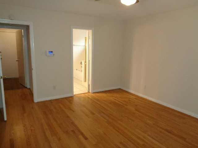 17823 Poppy Trails Lane Houston, TX 77084 - Photo 16 of 22 a view of empty room with wooden floor