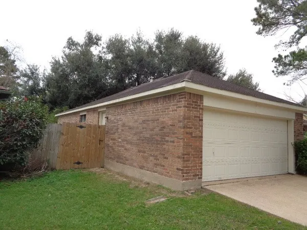 a backyard of a house with lots of tress
