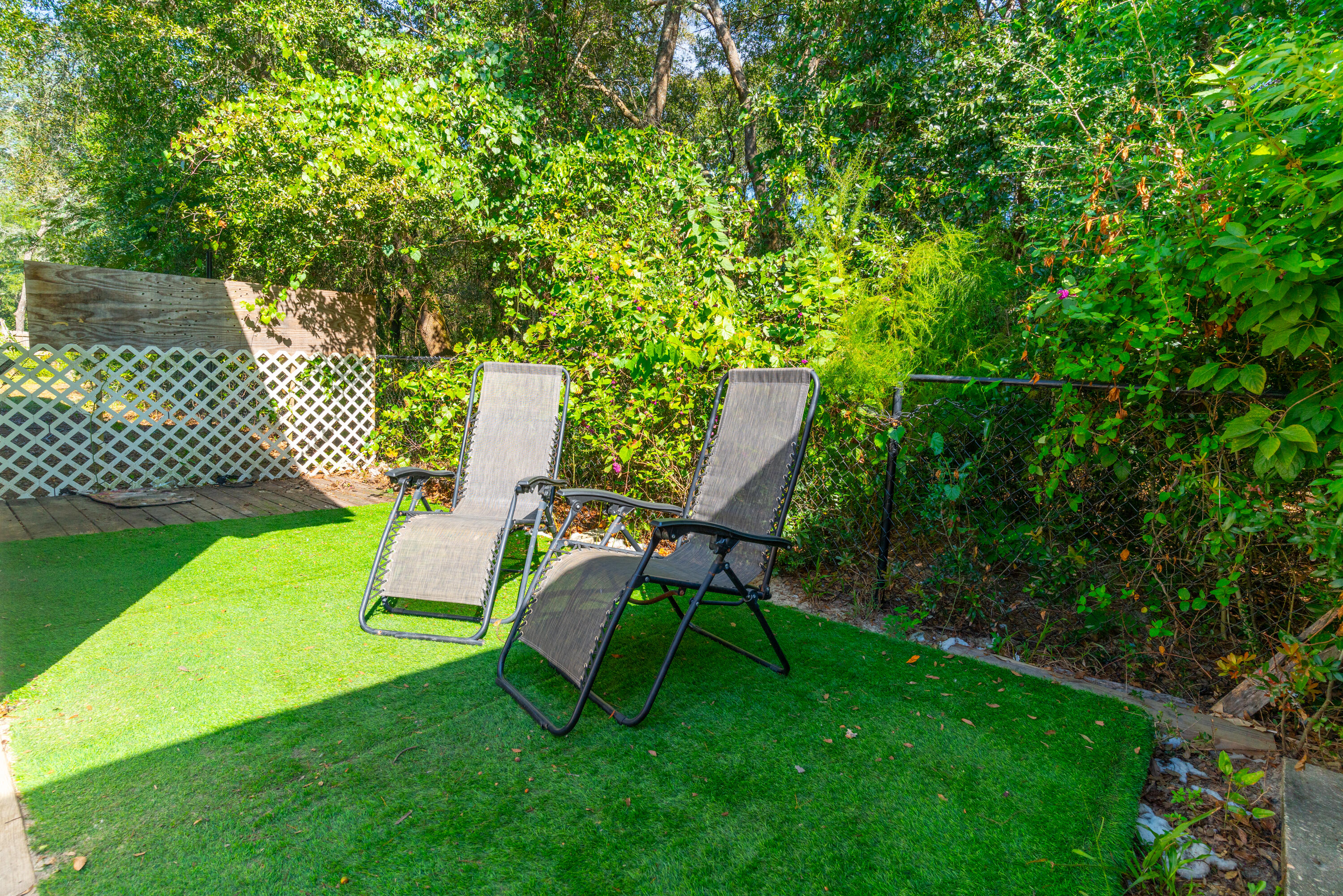 1530 Heritage Road Fort Walton Beach, FL 32547 - Photo 14 of 37 a view of a chair and table in the garden