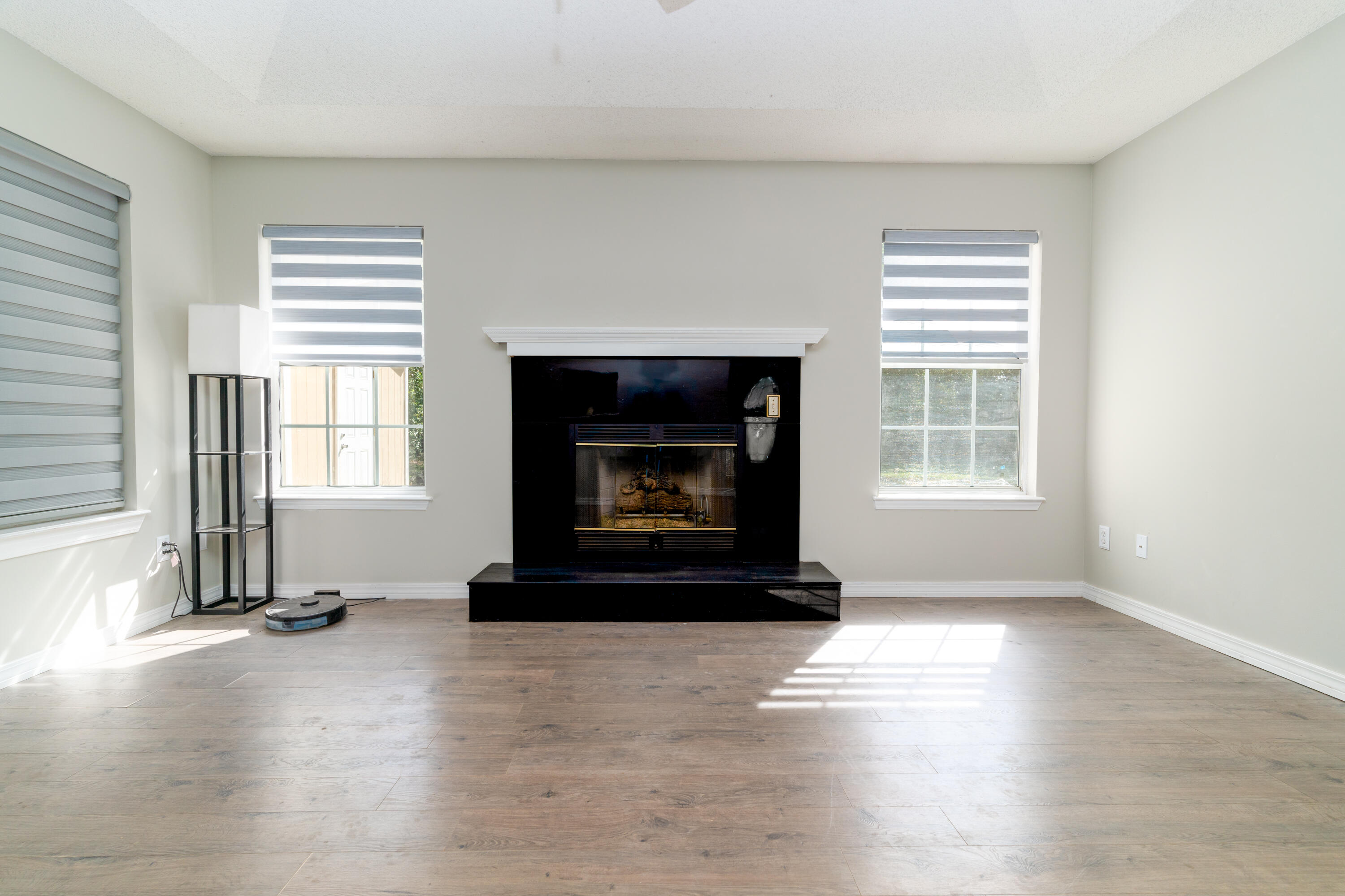 1530 Heritage Road Fort Walton Beach, FL 32547 - Photo 17 of 37 a living room with a fireplace and window