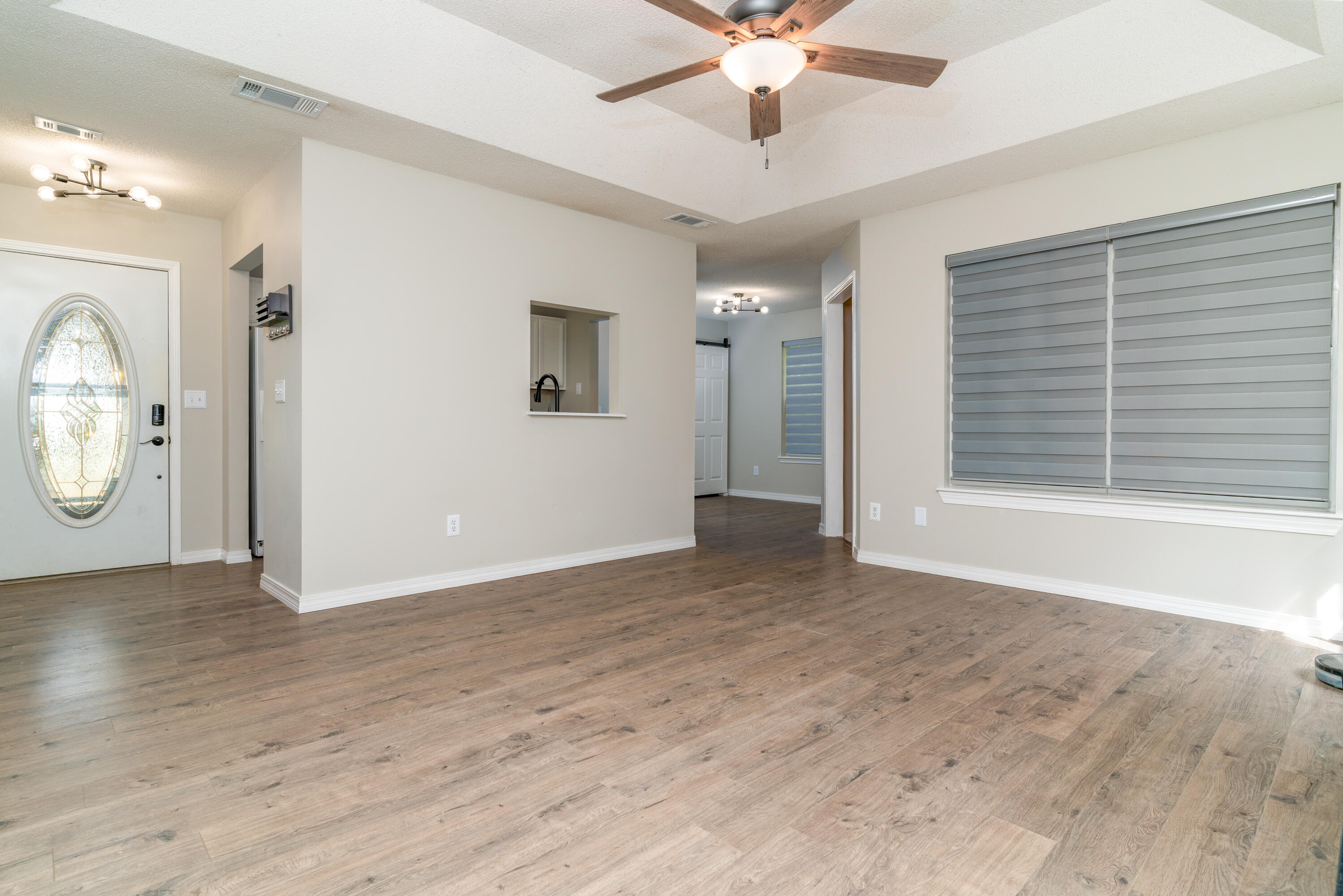 1530 Heritage Road Fort Walton Beach, FL 32547 - Photo 36 of 37 a view of an empty room with a window and wooden floor