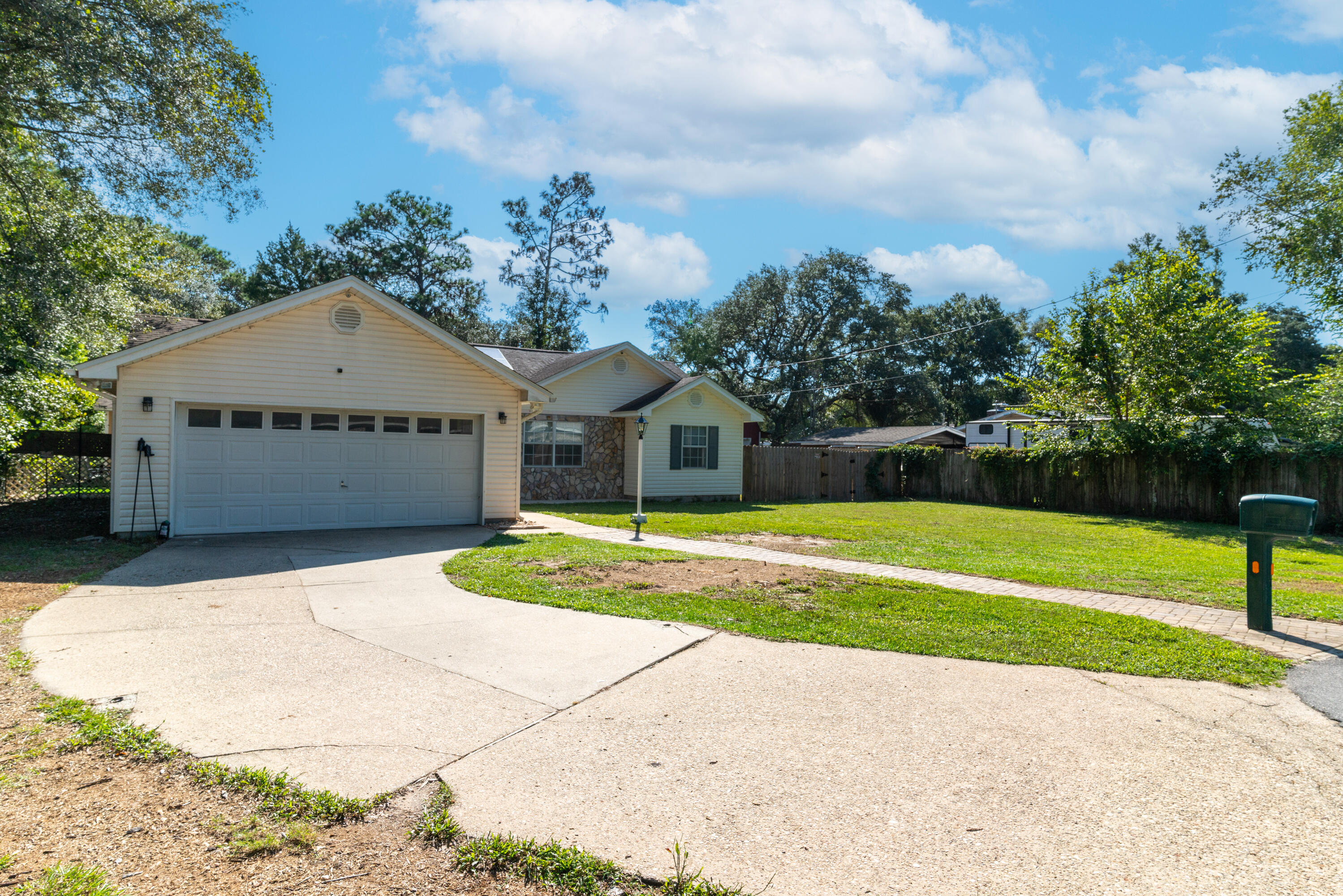 1530 Heritage Road Fort Walton Beach, FL 32547 - Photo 4 of 37 a front view of a house with garden