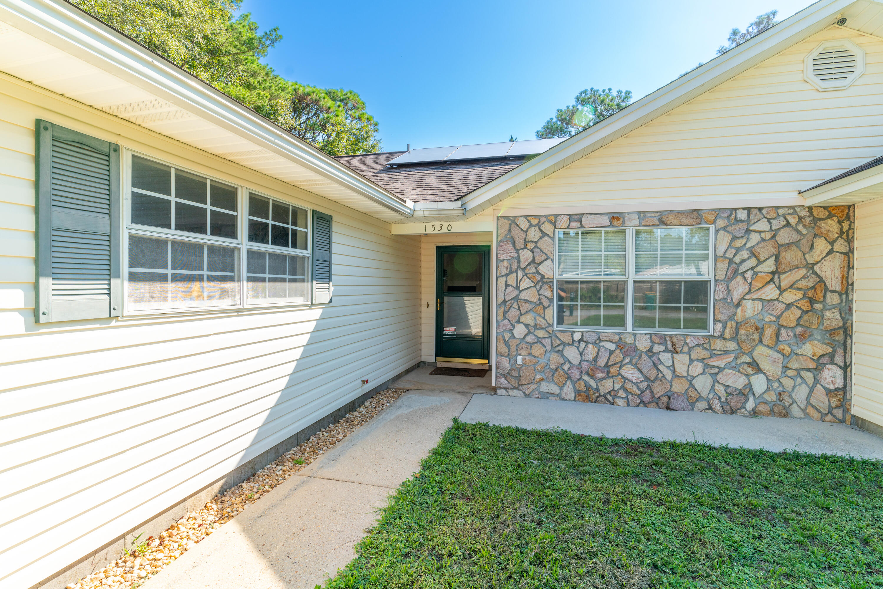 1530 Heritage Road Fort Walton Beach, FL 32547 - Photo 5 of 37 a view of a house with a yard