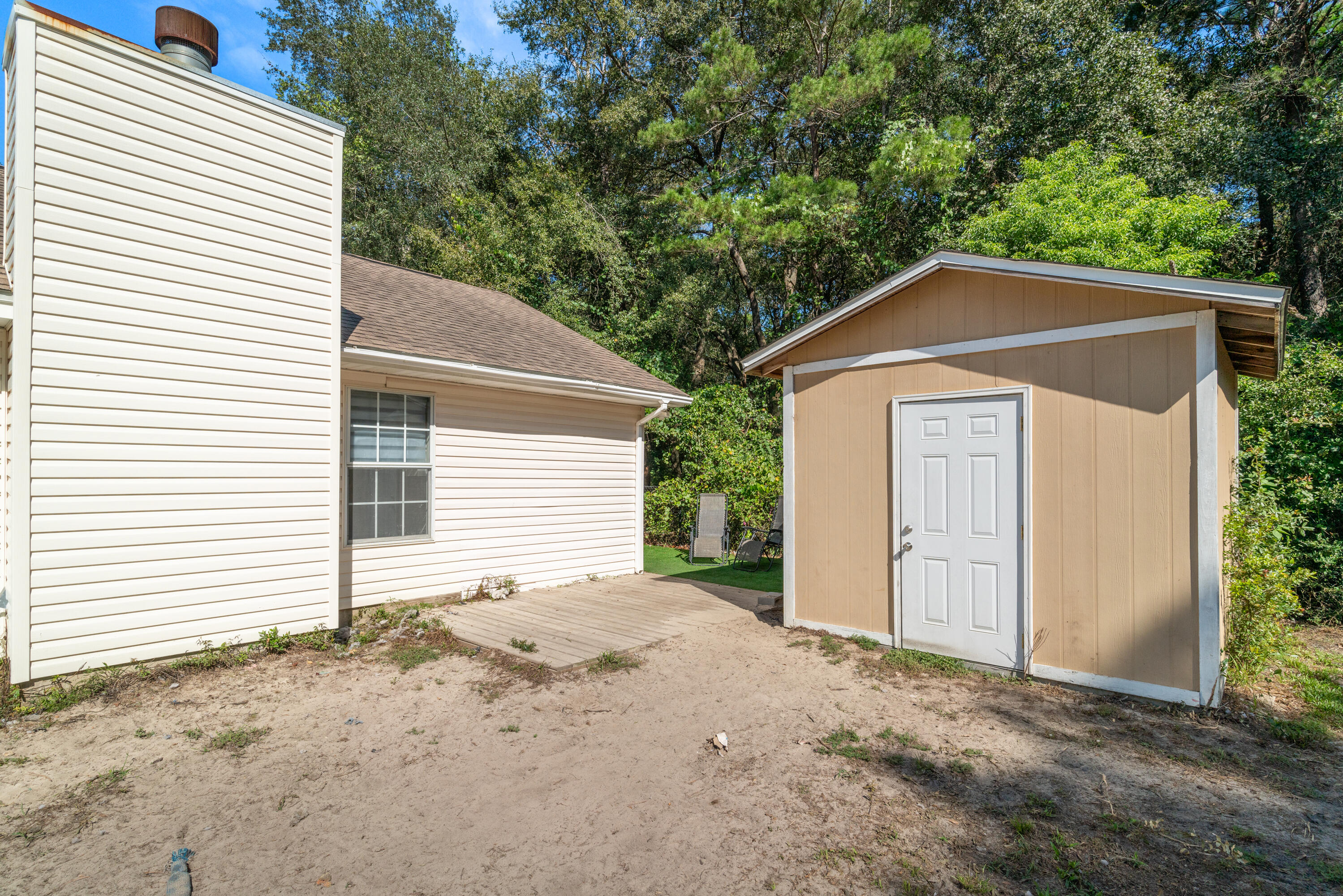 1530 Heritage Road Fort Walton Beach, FL 32547 - Photo 7 of 37 a front view of a house with a yard and garage
