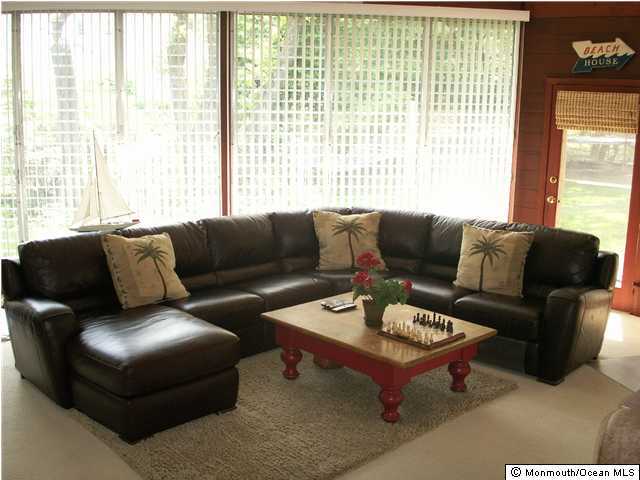 4 Robin Road Rumson, NJ 07760 - Photo 3 of 3 a living room with furniture and a large window