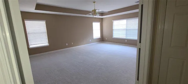 a view of a room with windows and chandelier