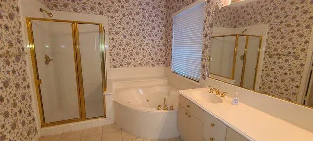 a bathroom with a bathtub and a sink
