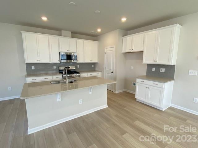 933 Cobbled Way, Unit 35 Fort Mill, SC 29715 - Photo 11 of 30 a kitchen with kitchen island sink stove and cabinets