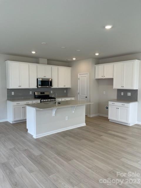 933 Cobbled Way, Unit 35 Fort Mill, SC 29715 - Photo 12 of 30 a view of kitchen with granite countertop stainless steel appliances refrigerator sink and cabinets