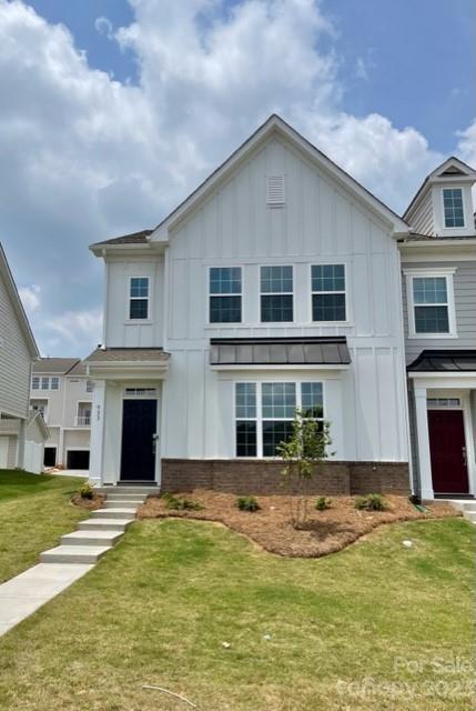 933 Cobbled Way, Unit 35 Fort Mill, SC 29715 - Photo 2 of 30 a front view of a house with a yard