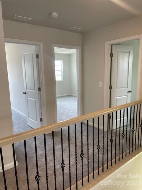 933 Cobbled Way, Unit 35 Fort Mill, SC 29715 - Photo 21 of 30 a view of a hallway with wooden floor and entryway