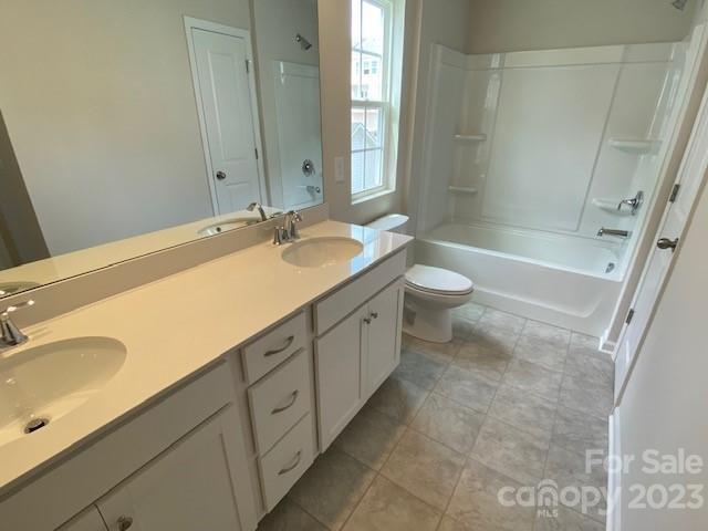 933 Cobbled Way, Unit 35 Fort Mill, SC 29715 - Photo 28 of 30 a spacious bathroom with a granite countertop sink toilet and shower