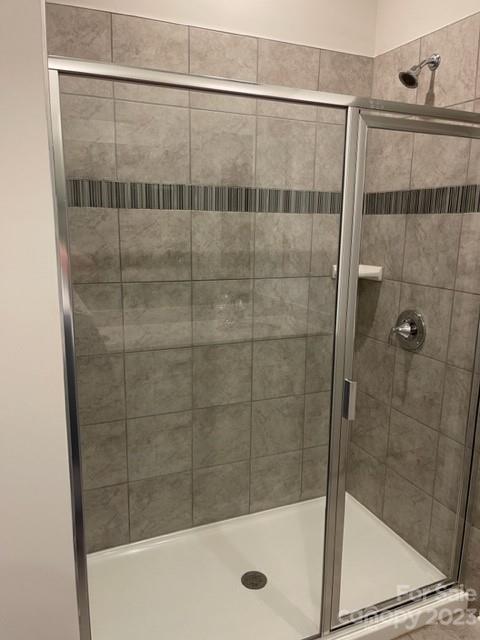 933 Cobbled Way, Unit 35 Fort Mill, SC 29715 - Photo 5 of 30 a bathroom with a shower and a bathtub