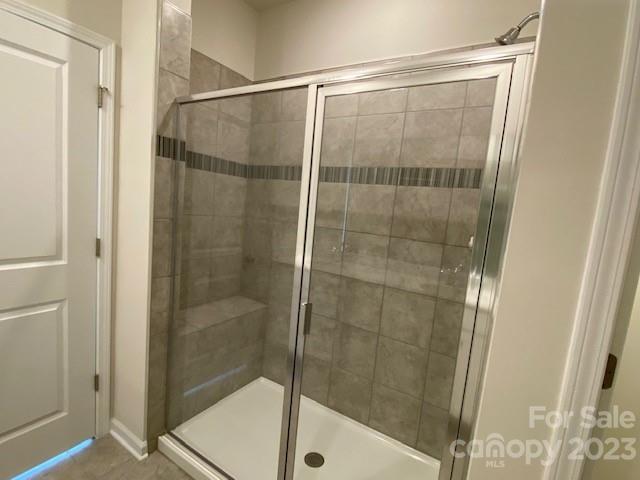 933 Cobbled Way, Unit 35 Fort Mill, SC 29715 - Photo 7 of 30 a bathroom with a glass shower door
