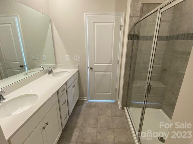 933 Cobbled Way, Unit 35 Fort Mill, SC 29715 - Photo 8 of 30 a spacious bathroom with a double vanity sink and a mirror