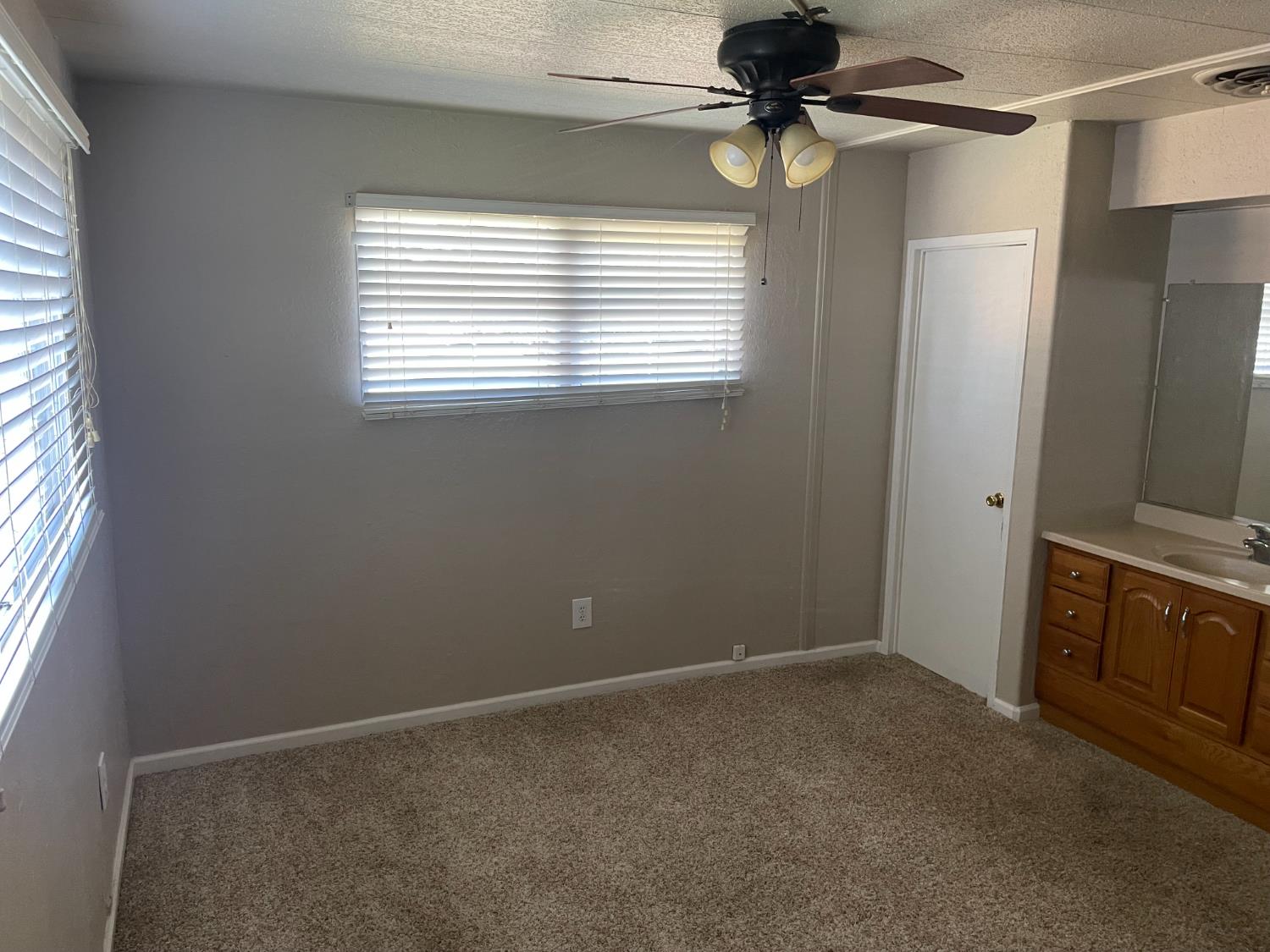 5835 Cherokee Road, Unit 61 Stockton, CA 95215 - Photo 7 of 10 a view of an empty room with window and cabinet