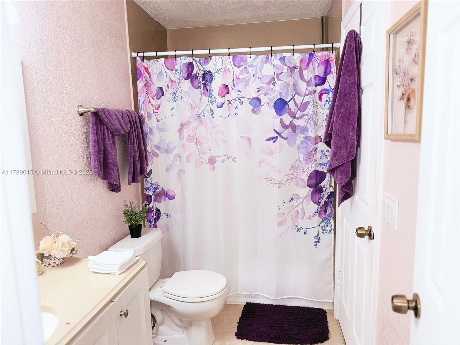 805 Riverside Drive, Unit 1111 Coral Springs, FL 33071 - Photo 12 of 16 a bathroom with a sink and toilet