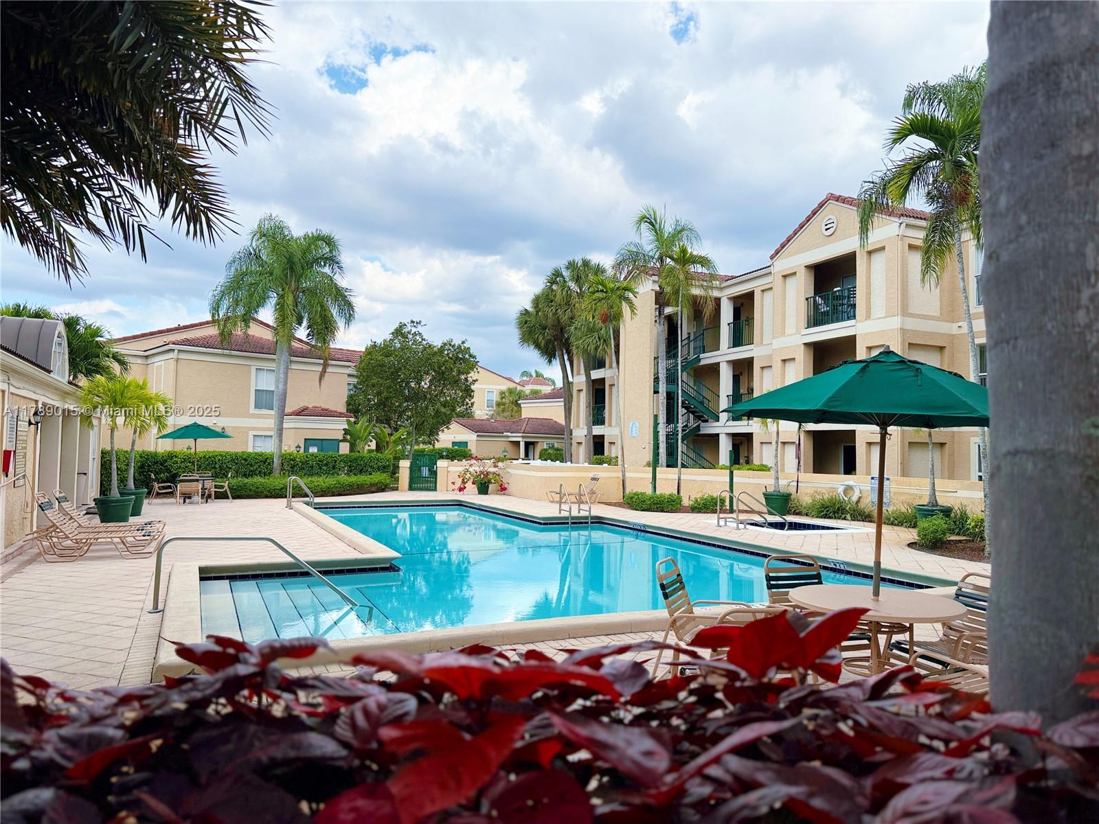 805 Riverside Drive, Unit 1111 Coral Springs, FL 33071 - Photo 13 of 16 a group of cars parked in front of a building