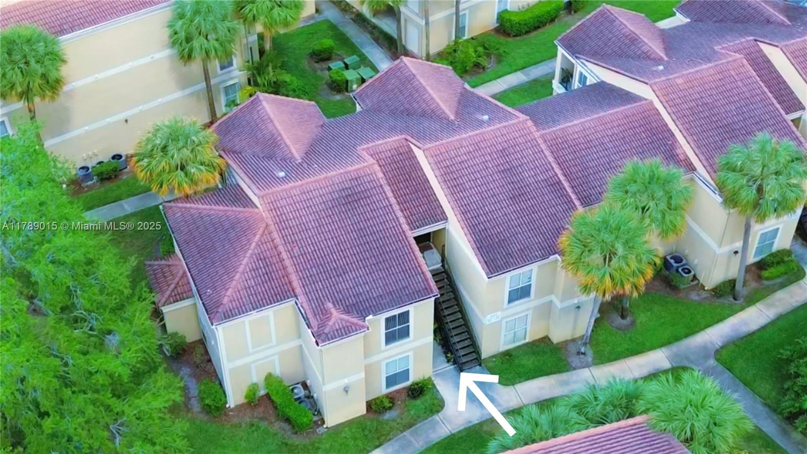 805 Riverside Drive, Unit 1111 Coral Springs, FL 33071 - Photo 16 of 16 a aerial view of a house with a yard and a garden