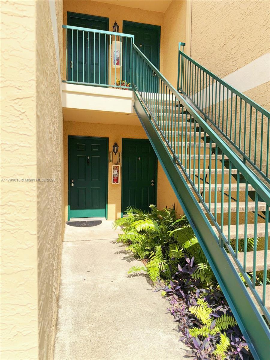 805 Riverside Drive, Unit 1111 Coral Springs, FL 33071 - Photo 2 of 16 a view of balcony with wooden floor