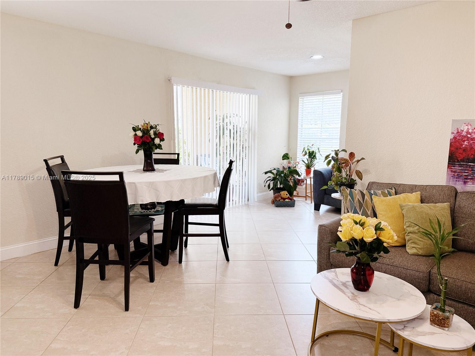 805 Riverside Drive, Unit 1111 Coral Springs, FL 33071 - Photo 4 of 16 a dining room with furniture and wooden floor