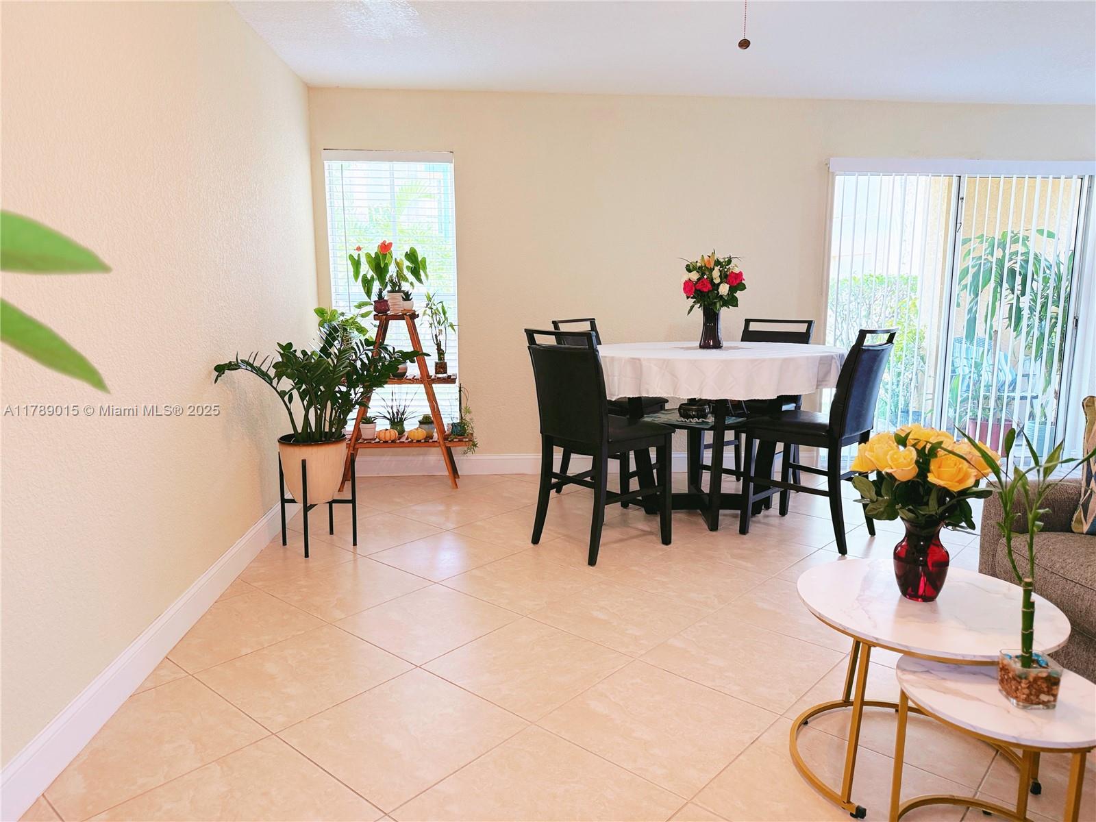 805 Riverside Drive, Unit 1111 Coral Springs, FL 33071 - Photo 6 of 16 a dining room filled chandelier and furniture